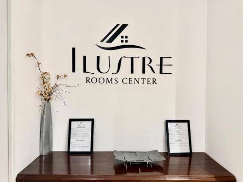 a table with a vase on it in a room at Ilustre Rooms Malaga in Málaga