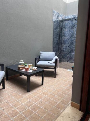 a living room with a couch and a coffee table at NoveQuattro Apartment in Cagliari