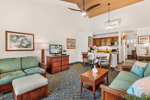 a living room with a couch and a table at Napili Shores E239 in Lahaina