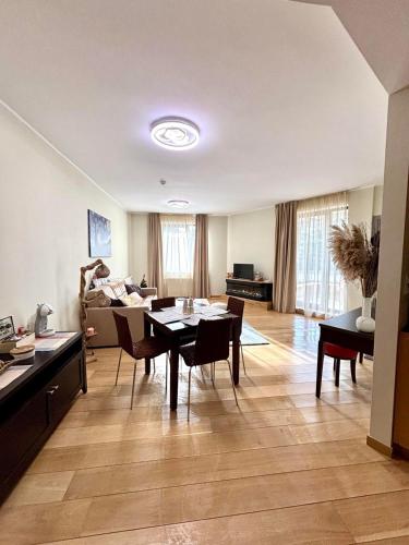 a large living room with a table and chairs at Alpine Charm Borovets Apart in Borovets