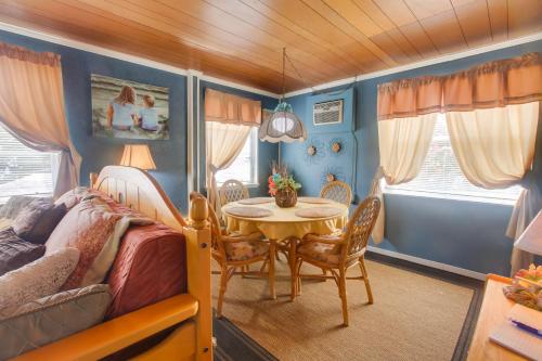 a bedroom with a bed and a table and chairs at Less Than 3 Mi to Golf and Swim Cozy Oasis in Lake Worth! in Lake Worth