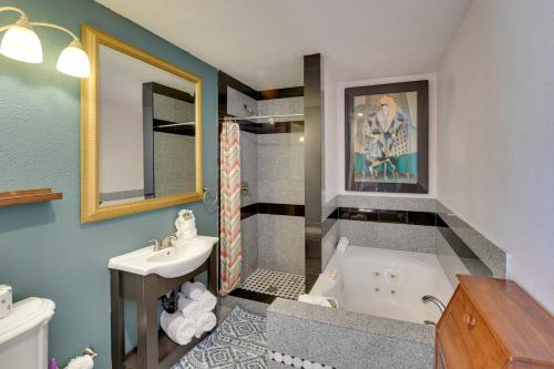a bathroom with a bath tub and a sink at Elegant Home with Pool Table 3 Mi to Vegas Strip! in Las Vegas