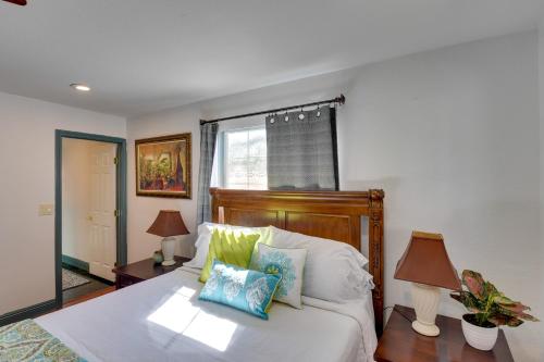 a bedroom with a bed with pillows and a window at Elegant Home with Pool Table 3 Mi to Vegas Strip! in Las Vegas