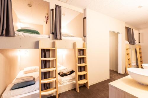 a dorm room with bunk beds and a sink at Sekine Building 4th floor - Vacation STAY 75338v in Tokyo