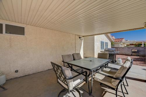 a patio with a table and chairs on a patio at Beautiful Las Vegas Home in Las Vegas