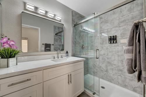 a bathroom with a sink and a shower at Beautiful Las Vegas Home in Las Vegas