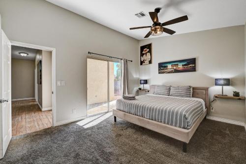 a bedroom with a bed and a ceiling fan at Beautiful Las Vegas Home in Las Vegas
