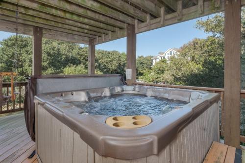 a jacuzzi tub on a deck at 4482 - Villa Al Mare in Duck