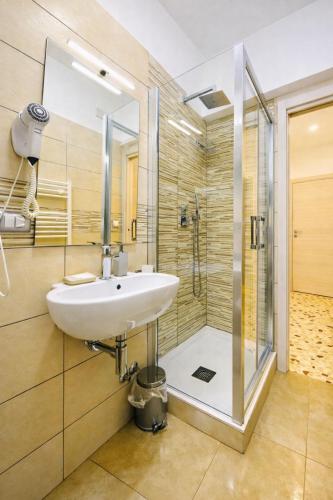 a bathroom with a sink and a shower at Floral Holiday in Minori