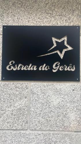 a sign for a gas station with a star on it at Estrela do Gerês - Casa Fernandes in Outeiro