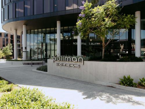 a building with a sign that reads cullman hotels at Pullman Sydney Penrith in Penrith