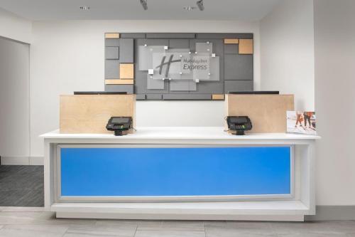 a table with two boxes on top of it at Holiday Inn Express San Antonio North Riverwalk Area by IHG in San Antonio