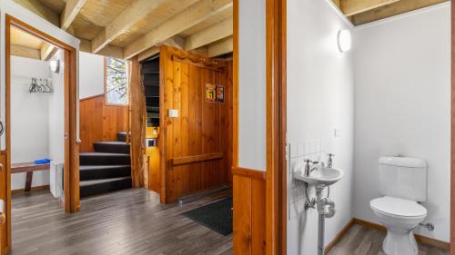 a bathroom with a toilet and a sink at Eagles Nest in Mount Hotham
