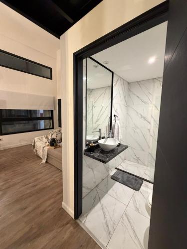 a bathroom with a sink and a mirror at Apart Hotel CABA in Buenos Aires