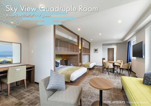 a hotel room with a bed and a desk at HOTEL MYSTAYS Hakodate Station in Hakodate