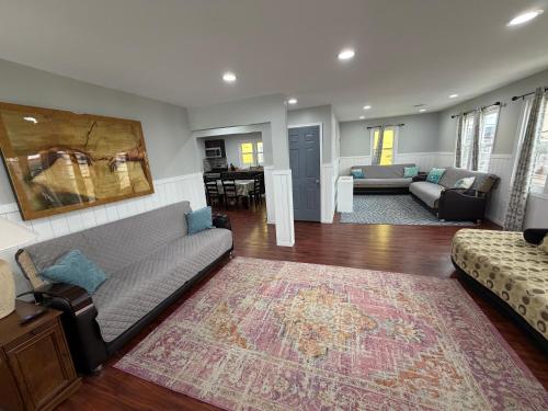 a living room with a couch and a rug at JD Apartment and House in Seaside Heights