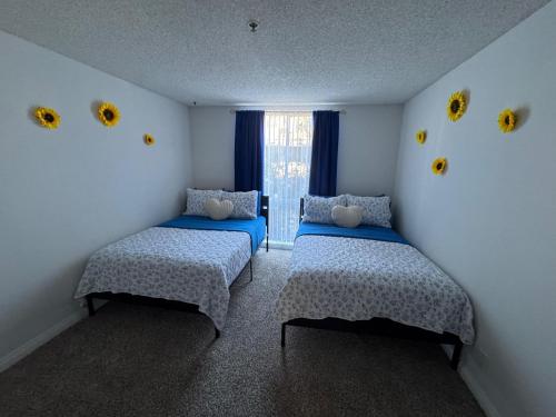 a room with two beds and a window at Mario, Disney & not themed Loft Universal Studios 10min loft apartment in Los Angeles