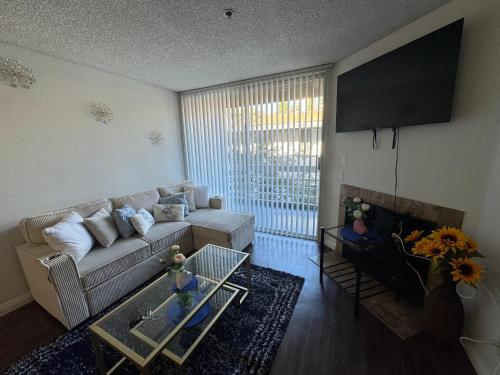 a living room with a couch and a table at Mario, Disney & not themed Loft Universal Studios 10min loft apartment in Los Angeles