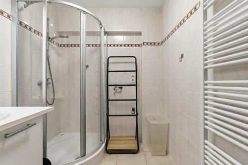 a bathroom with a shower and a toilet and a sink at Walter Vilain 0301 G in Sint-Idesbald