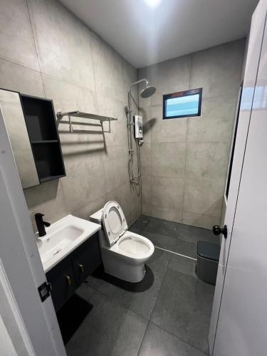a small bathroom with a toilet and a sink at The Forest Pool villa & cafe in Ban Wang Yao