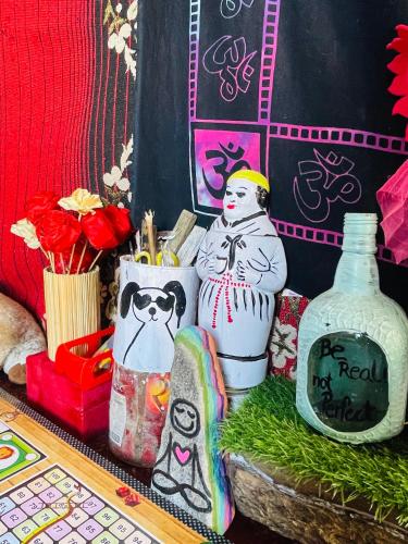 a group of vases sitting on top of a table at Mj s Home in Kalgha