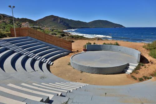 an empty amphitheater on a beach with the ocean at Village de vacances Paese di Lava, Grand Ajaccio in Alata