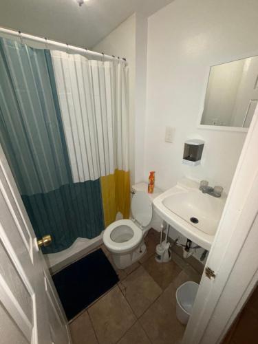 a bathroom with a sink and a toilet and a shower at Downtown Taylor Private Entry Room 2 in Phoenix