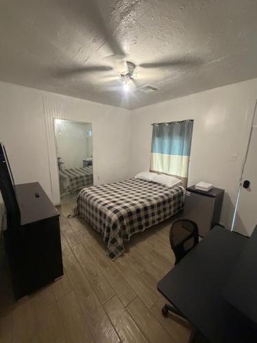 a bedroom with a bed and a ceiling fan at Downtown Taylor Private Entry Room 2 in Phoenix