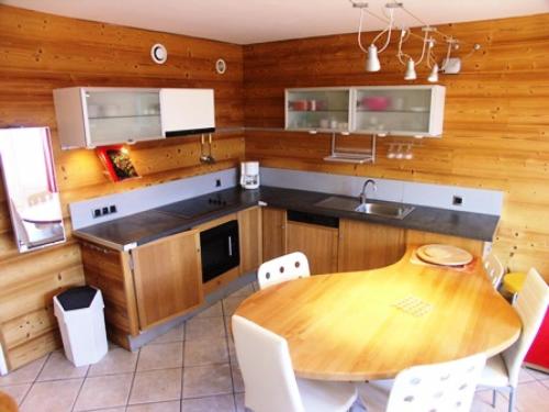 a kitchen with a wooden table and a dining room at Résidence Marmottes Ii - 3 pièces 6 personnes MAE-2780 in Orcières