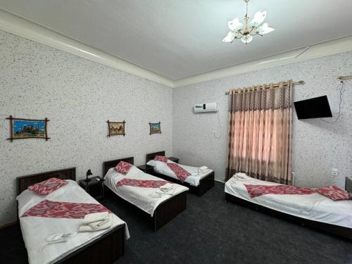 Postel nebo postele na pokoji v ubytování World Guest House
