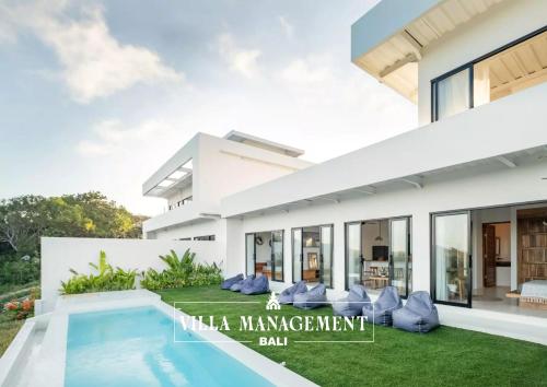 a villa management ball in a villa with a swimming pool at Villa Maracuya in Pecatu Bali - Spacious 3 Bedroom with Pool in Badung