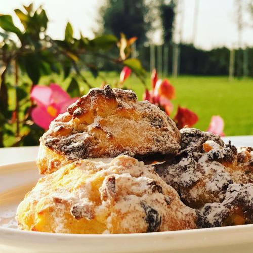 two biscuits on a plate on a table at Agriturismo Ca' Giulietta in Sommacampagna