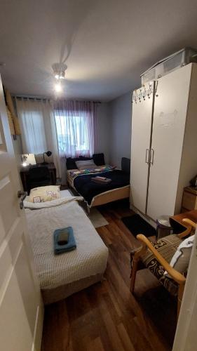 a small room with a living room and a room with at Cosy room in Oslo