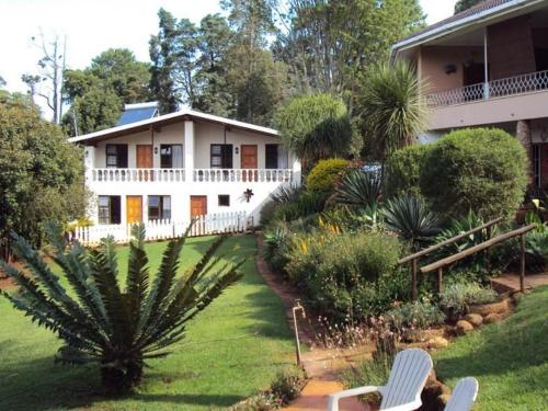 a house with a garden in front of it at Sunrise Guesthouse in Greytown