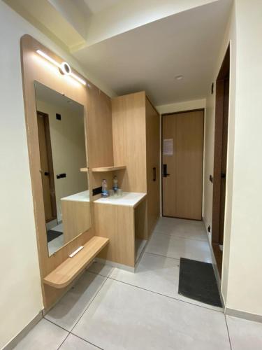 a bathroom with a sink and a mirror at Mahadev Hotel in Botād