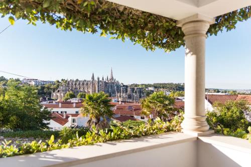 a view of the city from a balcony of a building at Boutique Hotel Casa do Outeiro - Arts & Crafts in Batalha