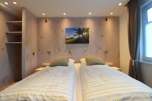 En eller flere senge i et værelse på Ferienwohnung am Lennepark