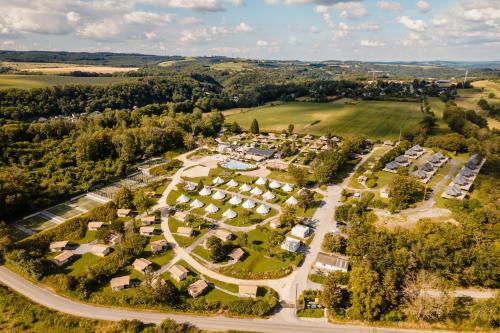 an aerial view of a park with houses at Greenfields Glamping Durbuy in Durbuy