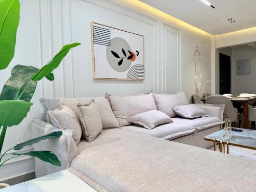 a living room with a couch and a table at LUXURY apartment October City in 6th Of October