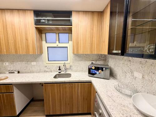 a kitchen with a sink and a counter top at LUXURY apartment October City in 6th Of October