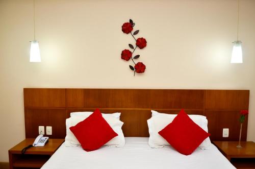 Кровать или кровати в номере Hotel Girassol