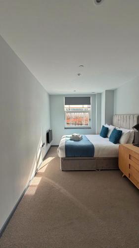 a bedroom with a large bed and a window at Ibis House by Viridian Apartments in Richmond