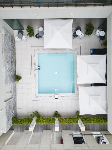 an overhead view of a swimming pool in a building at Hotel Nestos in Omiš