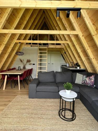 a living room with a couch and a table at Parc Sonnleiten - A Chalet in Gnesau