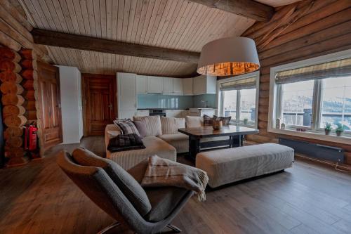 a living room with a couch and a table at Meraftahornvegen 36 in Stranda