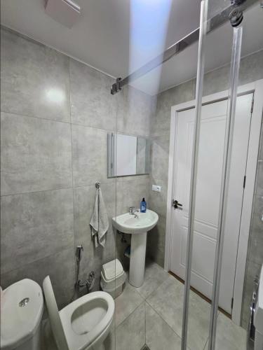 a bathroom with a toilet and a sink at Tbilisi- Georgia in Tbilisi City
