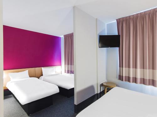 En eller flere senger på et rom på B&B HOTEL Toulouse Basso Cambo