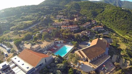 an aerial view of a house with a swimming pool at Village de vacances Paese di Lava, Grand Ajaccio in Alata