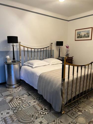 a bedroom with a large bed with two lamps at Chez Montiz in Montazels