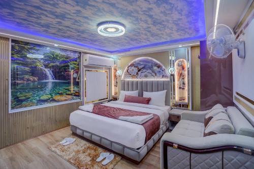 a bedroom with two beds and a painting on the wall at Hotel Armani Suites-Free Airport Drop in New Delhi